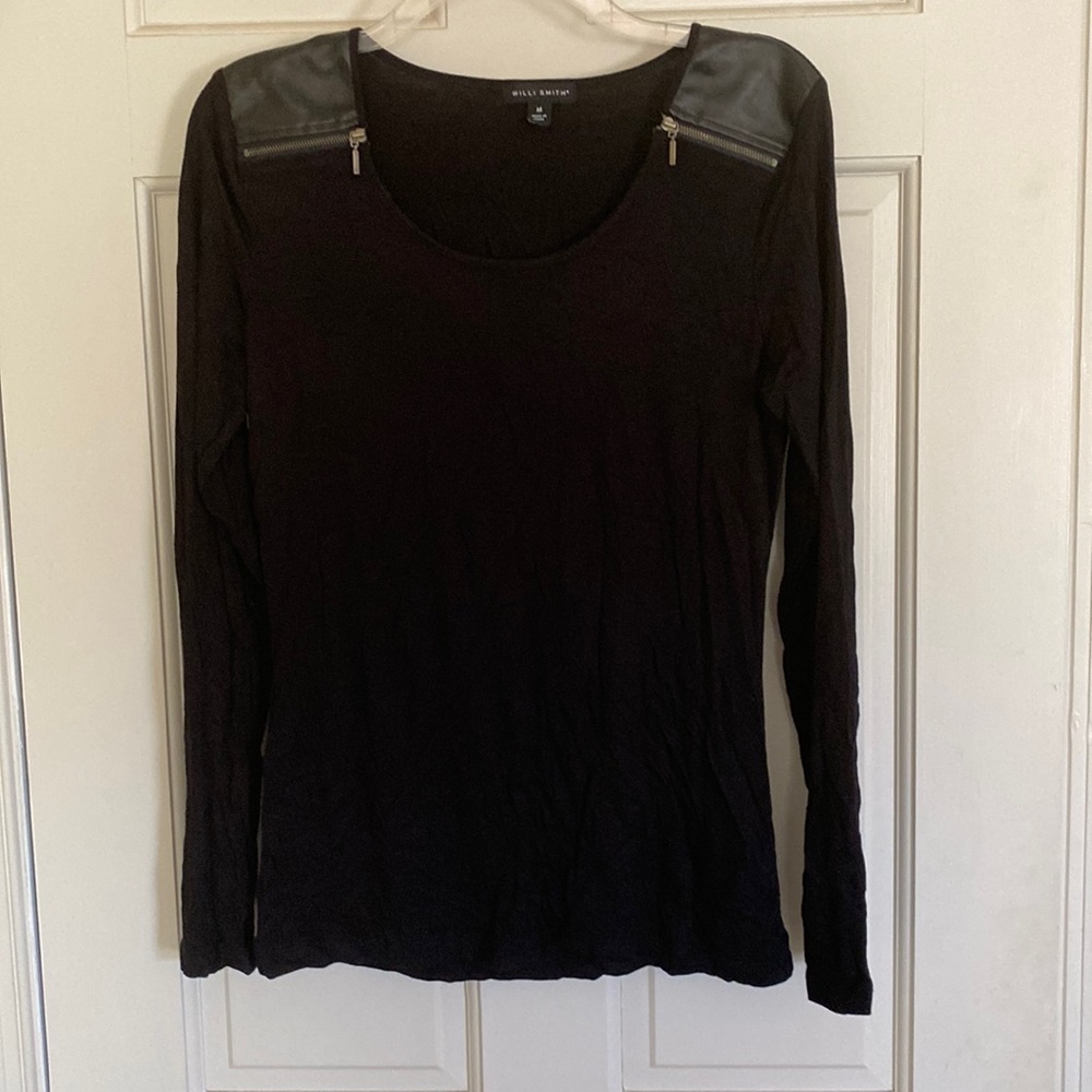 Long sleeved black top.